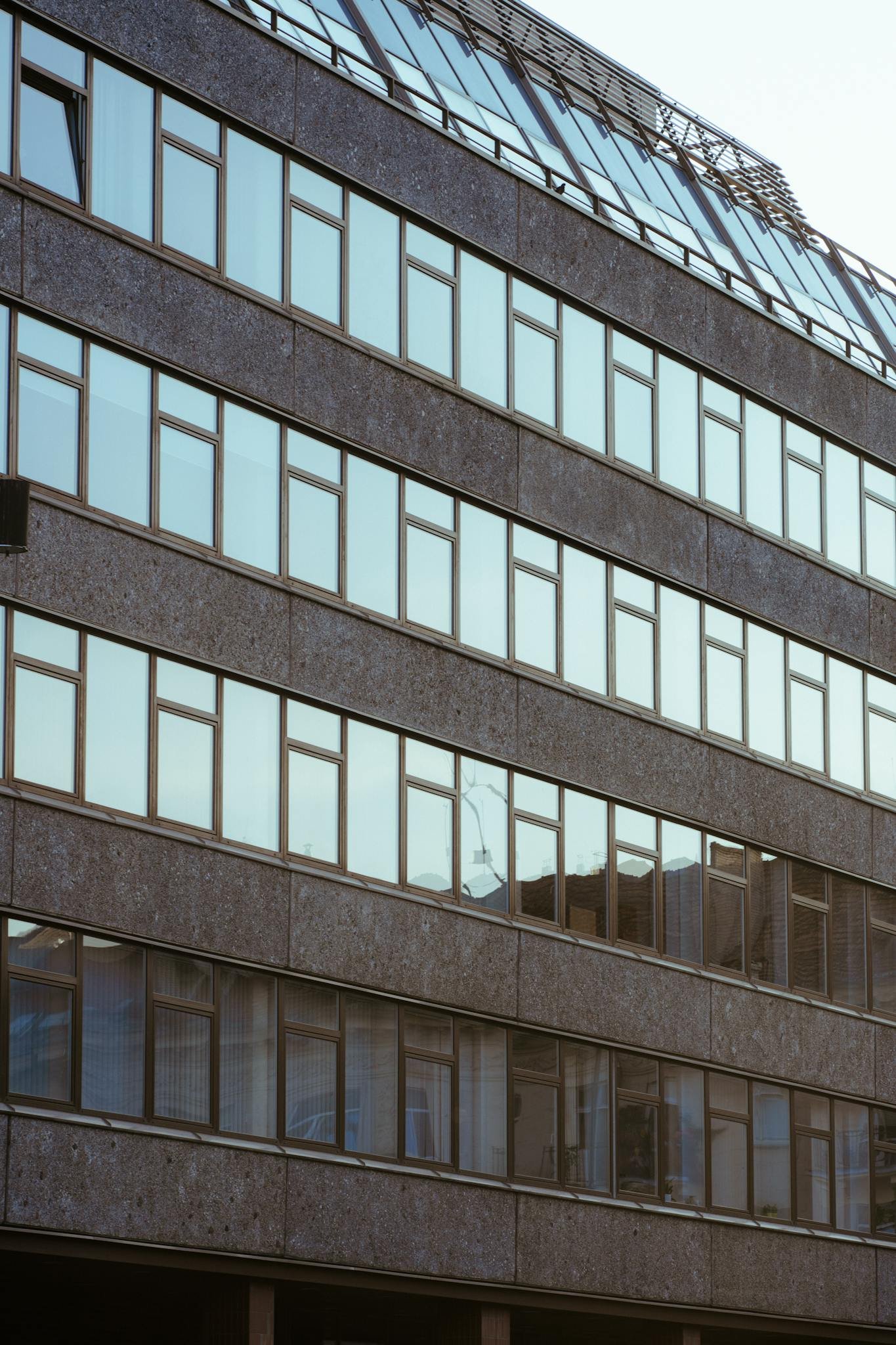 A large building with many windows and a street